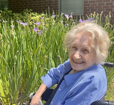 Senior resident enjoying time in the garden