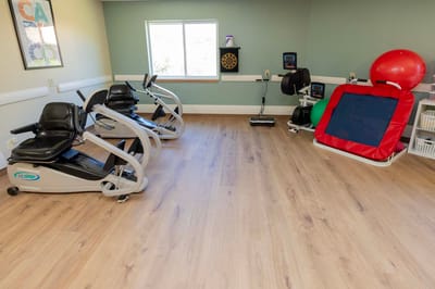 Well-equipped therapy room with exercise equipment