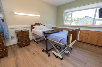 A well-equipped resident room with a bed and furniture