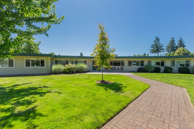 A view of the facility's exterior with landscaped grounds