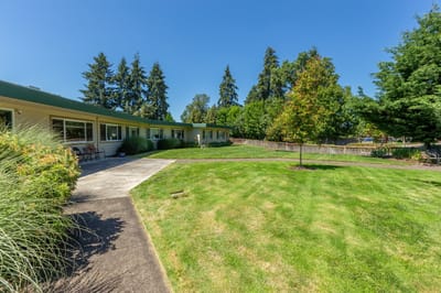 Outdoor space with landscaped garden and building nearby