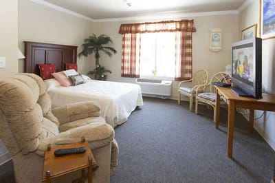 Cozy resident room with a bed and seating area