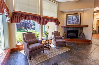 Cozy seating area in a common space with a view outside