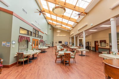 Bright common area with tables and chairs