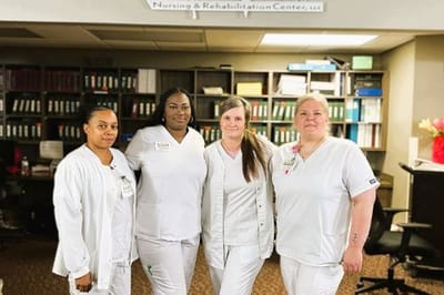 Staff members posing in the facility's interior
