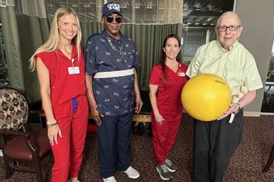 Staff and residents engaging in an activity