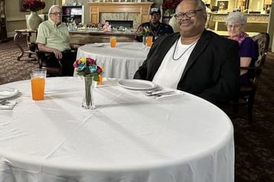 Residents enjoying a meal in the dining room