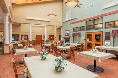Interior view of a dining room with tables and chairs