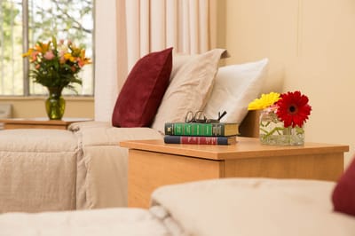 Cozy resident room with flowers and books