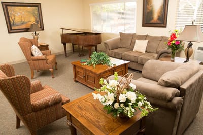 Cozy common area with seating and piano