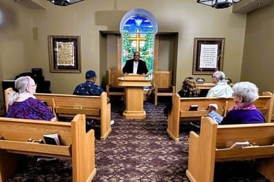 Residents attending a service in a chapel