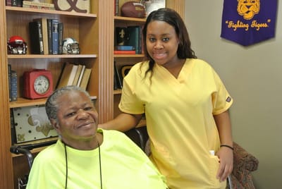 Caregiver with resident in a cozy interior setting
