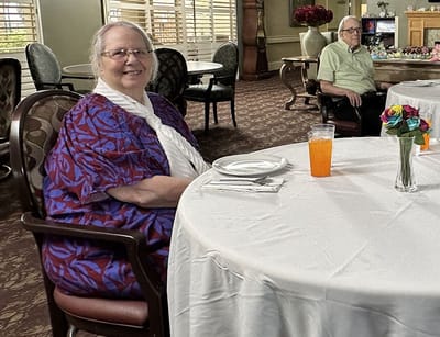 Residents enjoying a meal in the dining area