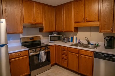 Well-equipped kitchen with wooden cabinets