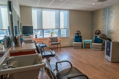Interior view of a stylish salon with chairs and decor