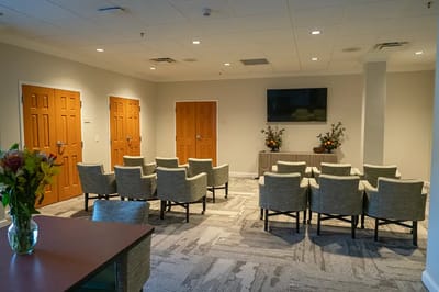 Interior common area with seating and a television