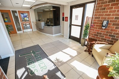 Interior lobby area with seating and reception
