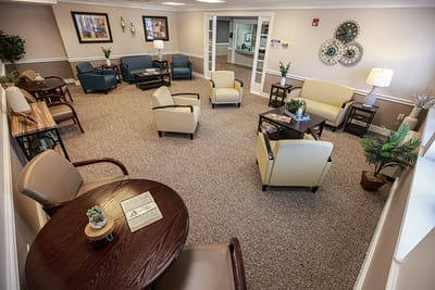 Bright common area with comfortable seating and decor