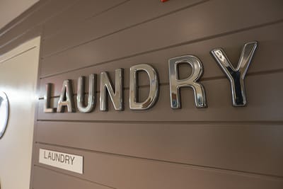 Laundry sign on a facility wall