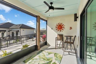 Outdoor lounge area with seating and sun decor