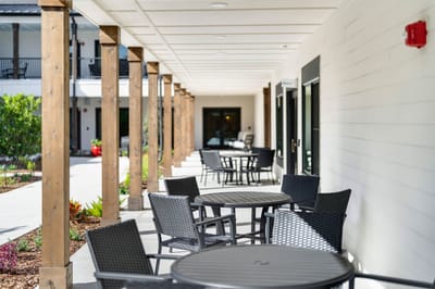 Outdoor seating area with tables and chairs