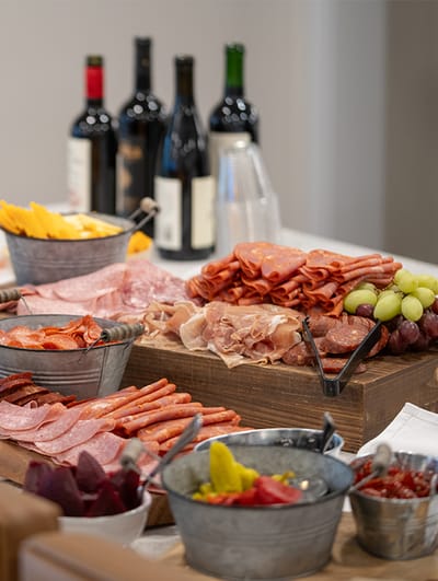 A charcuterie board with assorted meats and cheeses