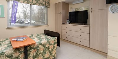 Cozy resident room with a TV and decor