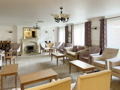 Common lounge area with seating and natural light