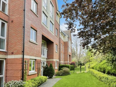 Exterior view of the Highpoint Senior Living building and gardens