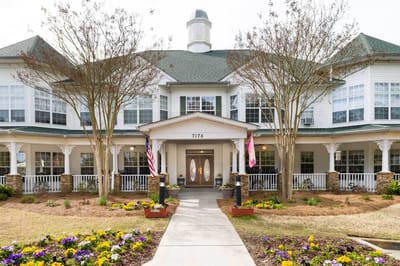 Exterior view of Azalea Estates Assisted Living with landscaping