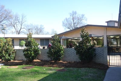 Exterior view of the facility featuring landscaping.