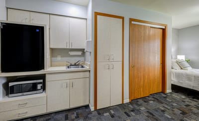 Interior view of a resident room with kitchen area
