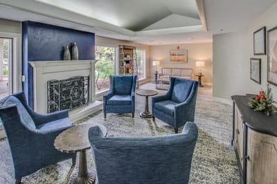 Common area with comfortable chairs and a fireplace