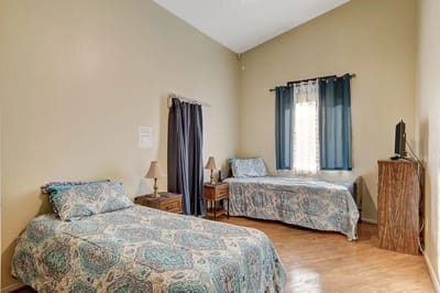 Private resident room with two beds and decor