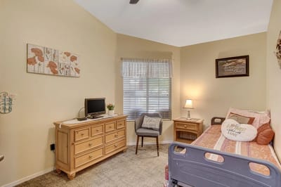 Cozy private resident room with a bed and dresser