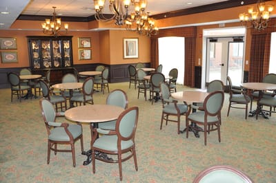 Dining room with tables and chairs set up
