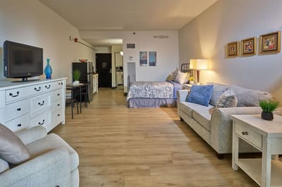 A cozy resident room with furniture and decor