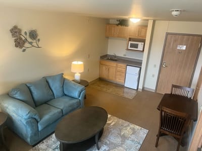 Cozy resident room with furniture and kitchenette