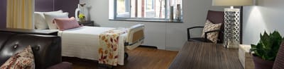 Cozy private resident room with a bed and desk