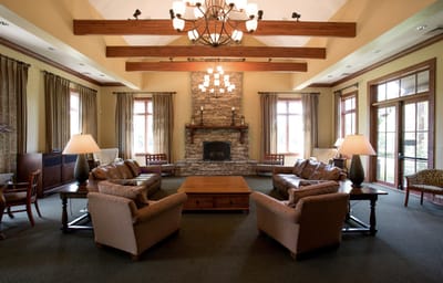 Cozy interior lounge area with seating and fireplace