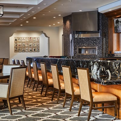 Dining area with elegant seating and decor