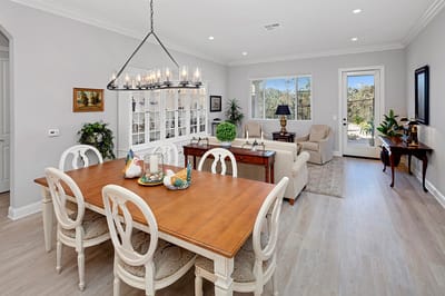 Bright common area with dining table and seating