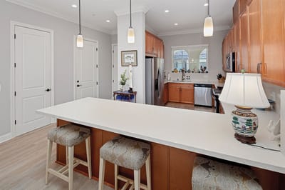 Bright, modern kitchen with seating area