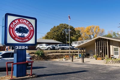 Exterior view of Oak Creek Senior Living sign and building