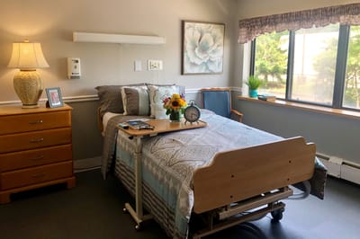 Well-furnished resident room with bed and decor
