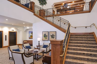 Elegant lobby area with stairs and seating