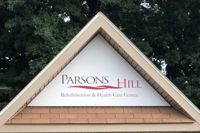 Facility logo on the building exterior