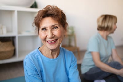 Old Cheney Rehabilitation, Nursing Home in Lincoln, NE — Smiling senior woman in a casual activity setting