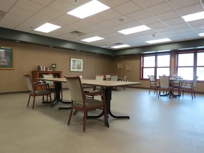 Bright common area with tables and chairs