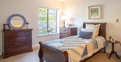 Cozy resident room with natural light and warm decor